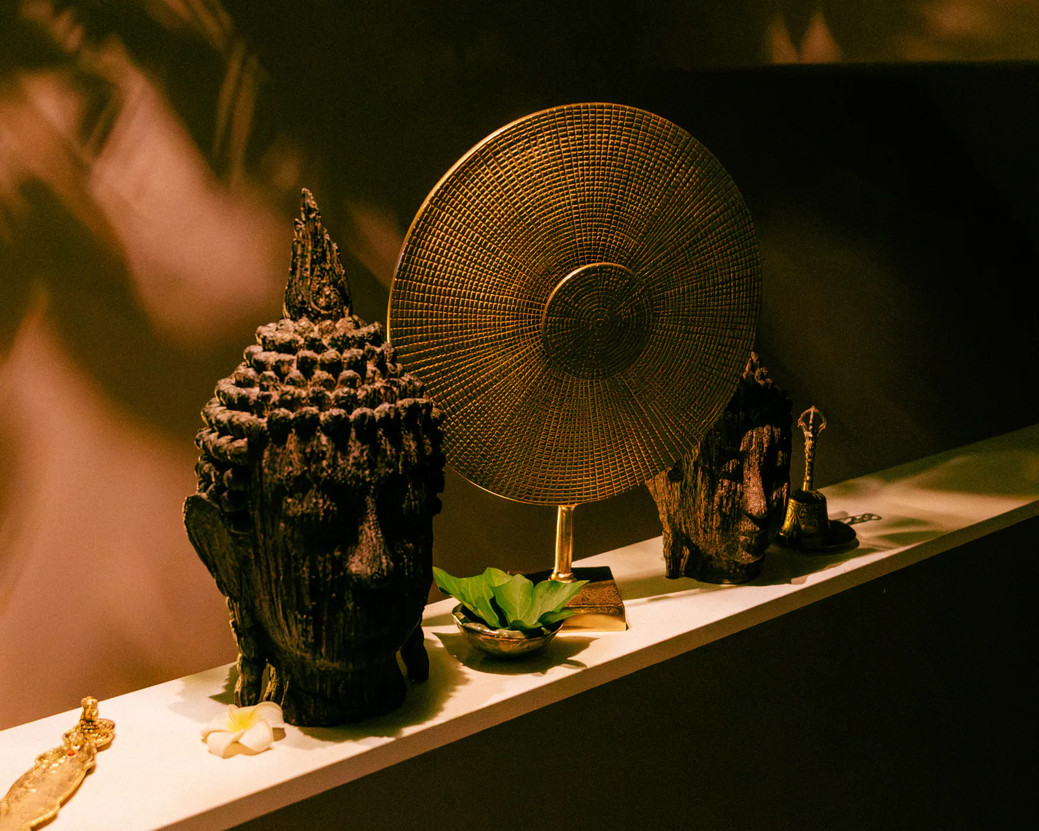 Sculptural objects arranged on a shelf in the spa interior