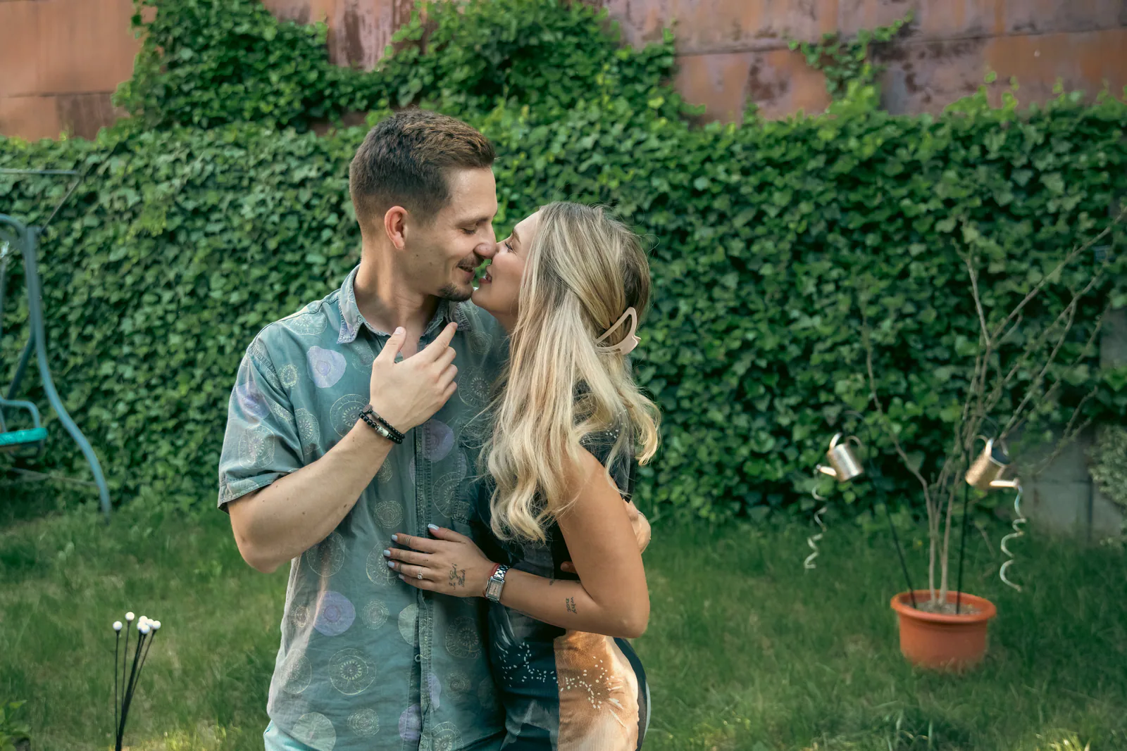 Darius and Valentina standing together in a garden