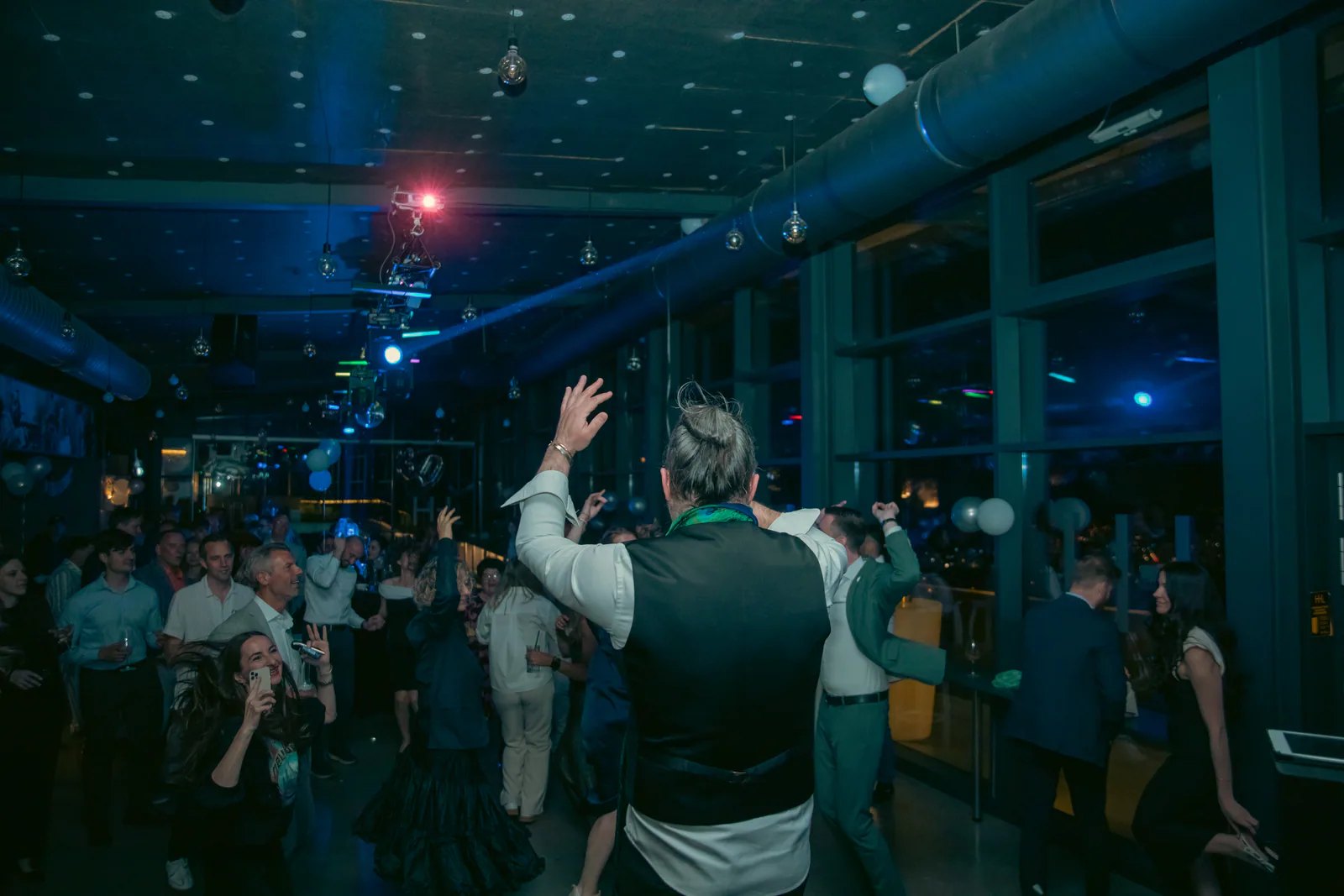 Guests celebrating together on a dance floor