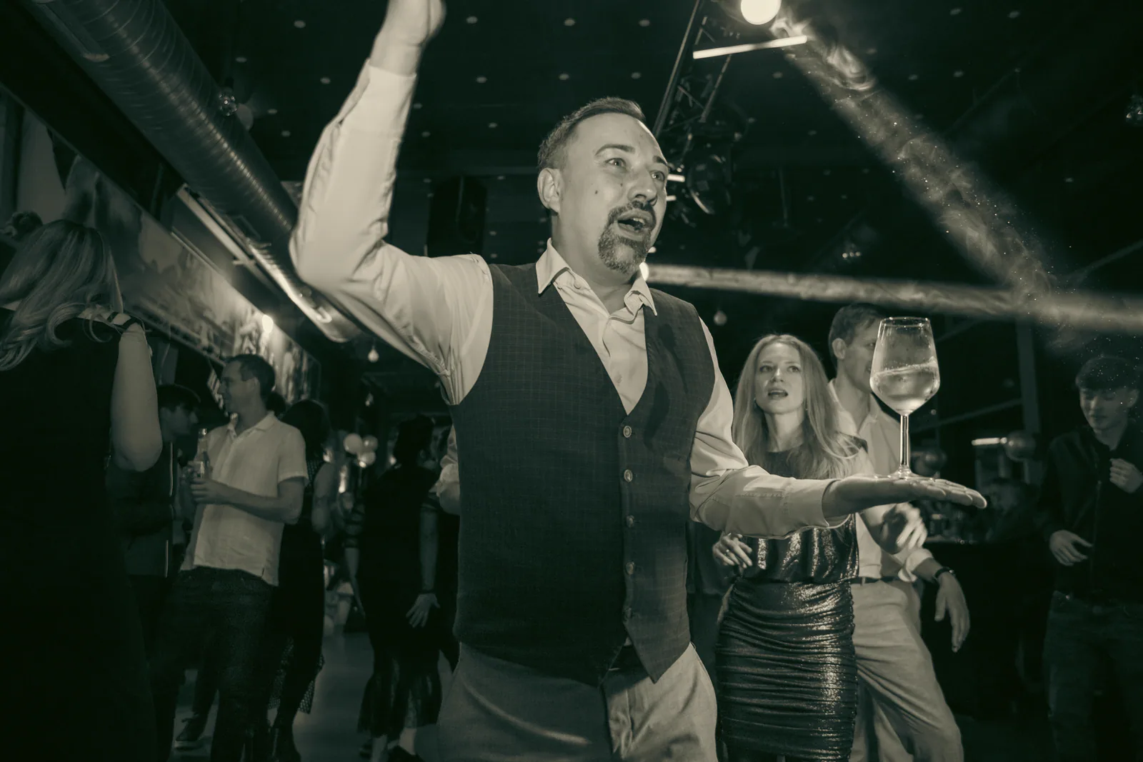 Event host speaking on a dance floor