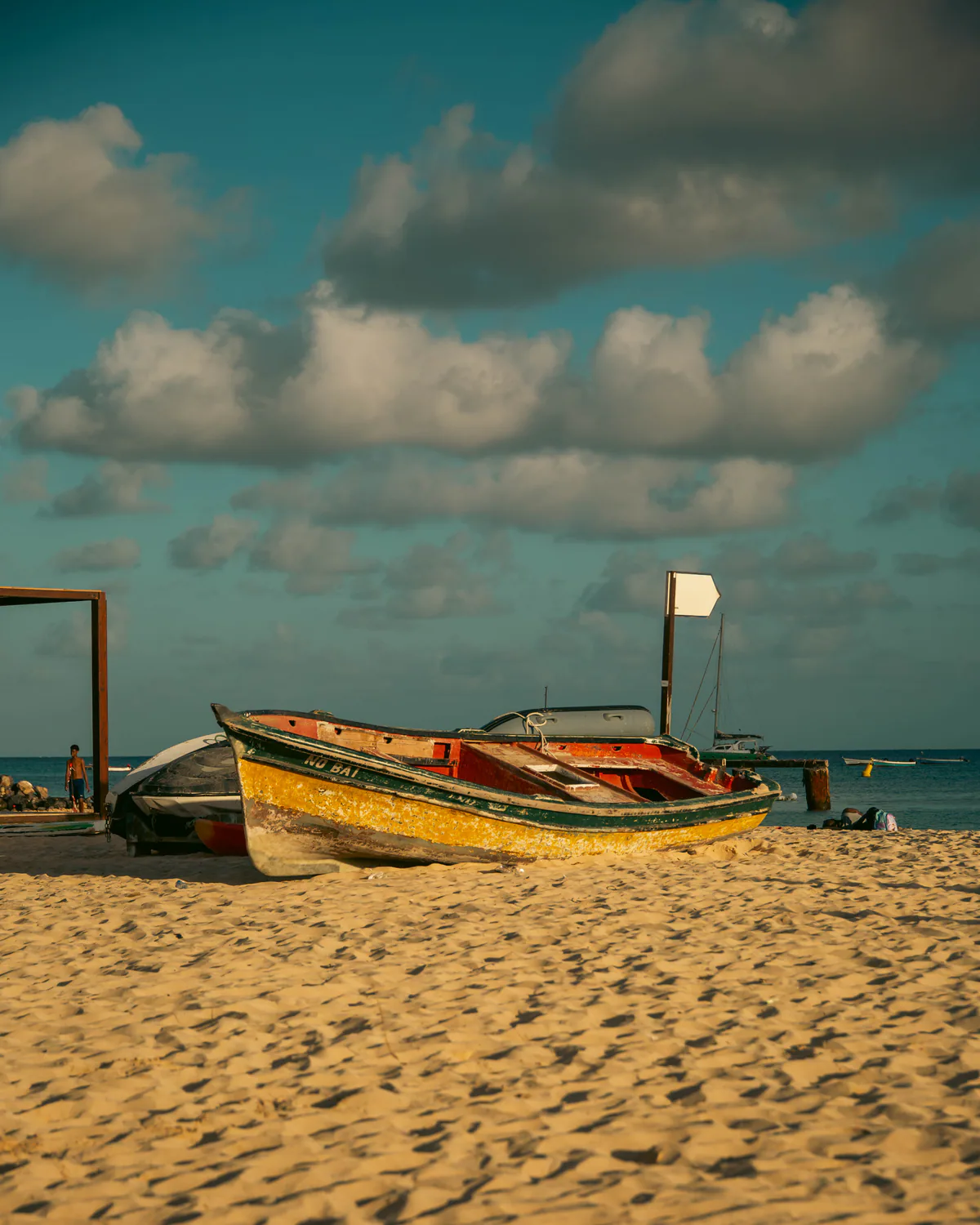 Small boats resting on a sandy shore