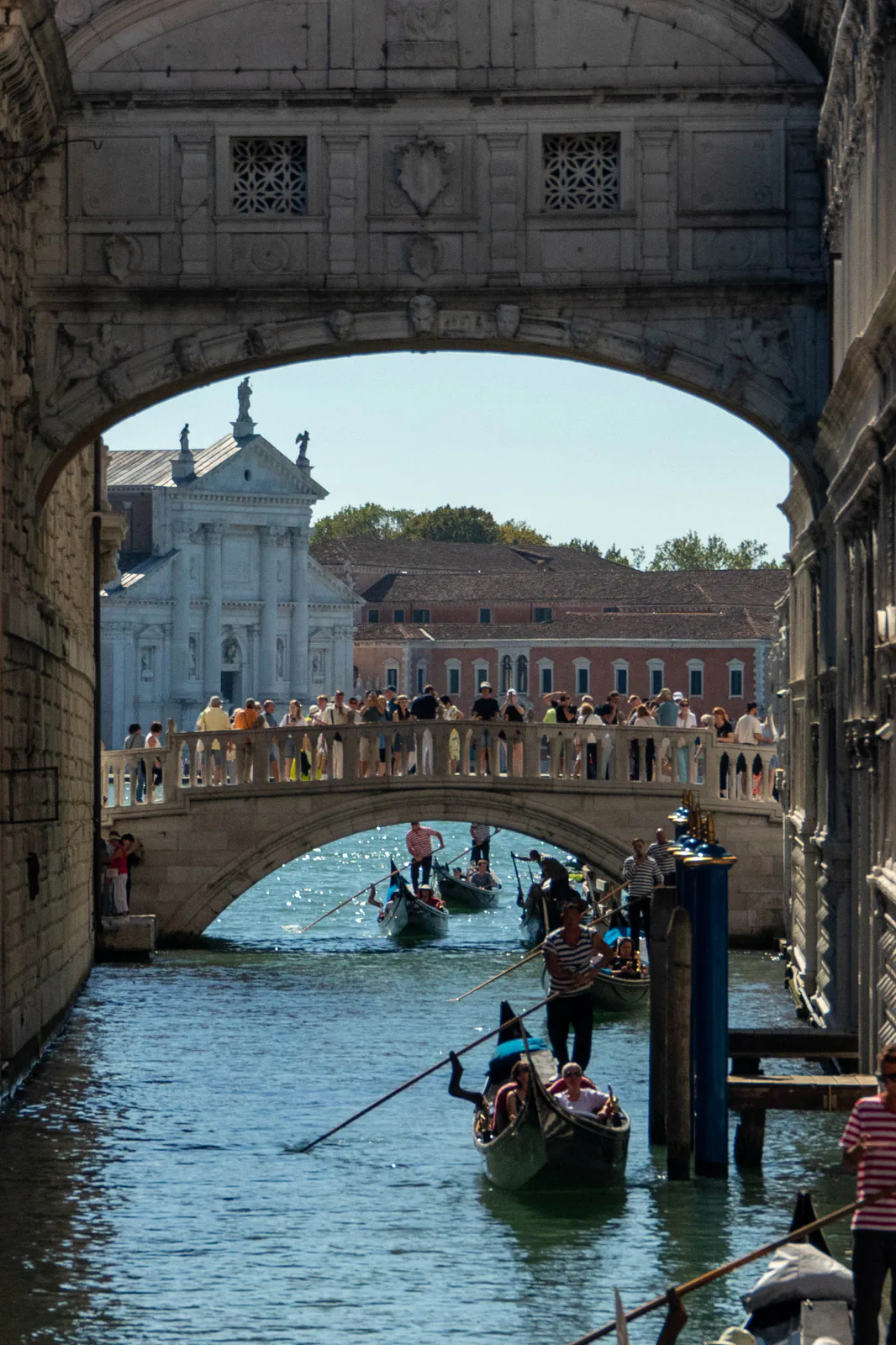 Canal visible through a weathered stone arch