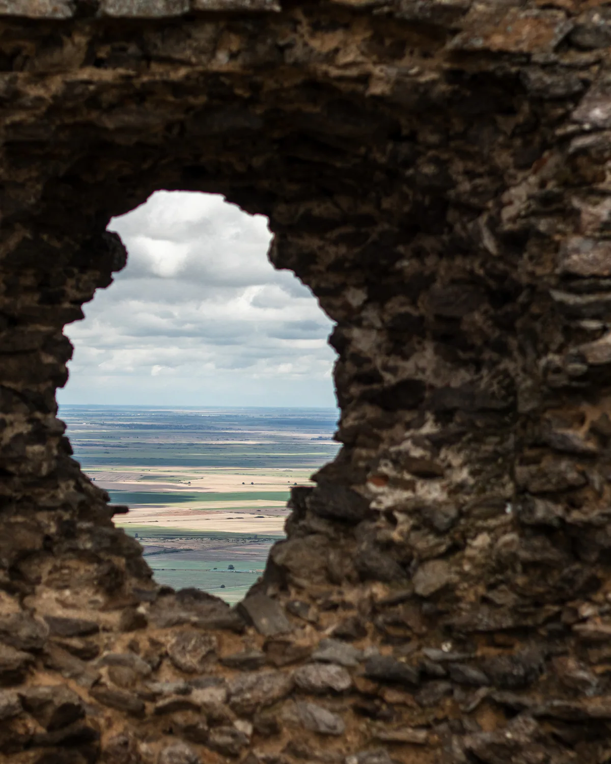 Landscape framed by an opening in a rock formation